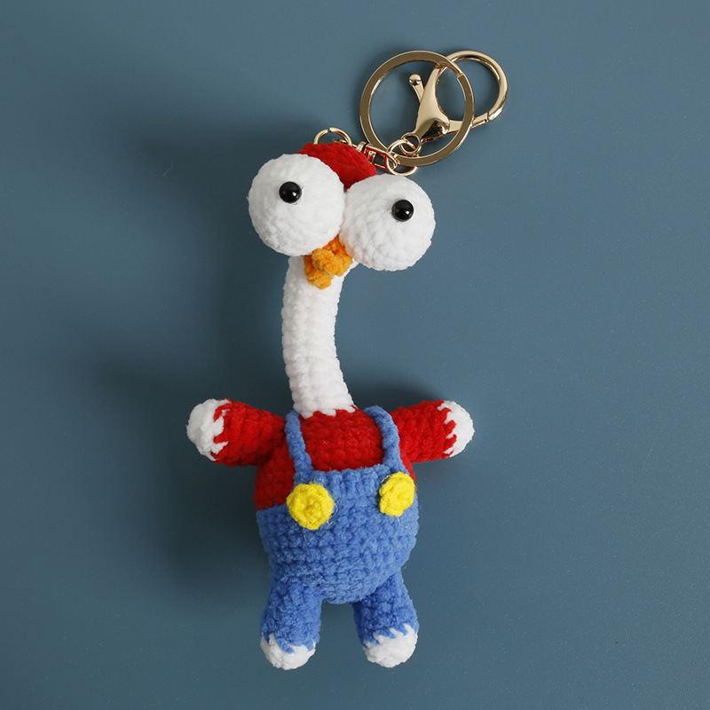 Original long-neck crochet bird keychain in red and blue overalls