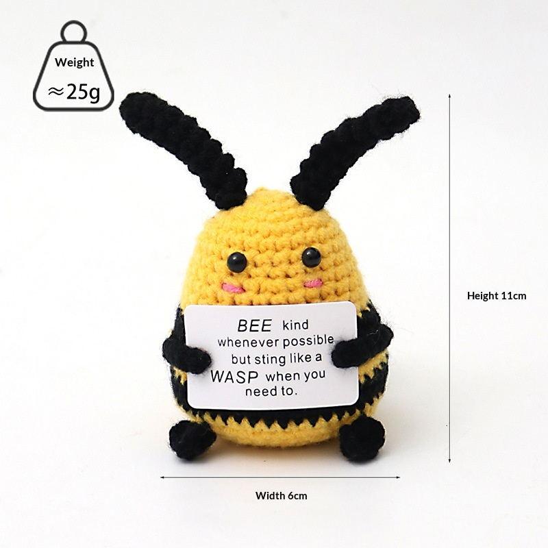 Small bee positive crochet companion holding an encouraging message card